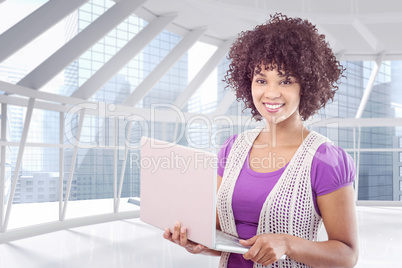 Composite image of student with laptop