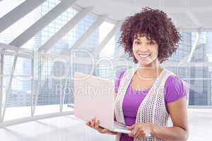 Composite image of student with laptop