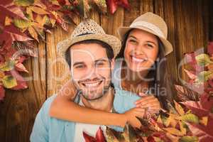 Composite image of happy casual man giving pretty girlfriend pig