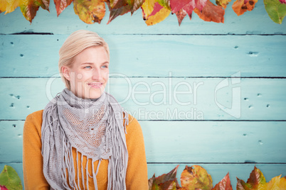 Composite image of smiling woman wearing a scarf