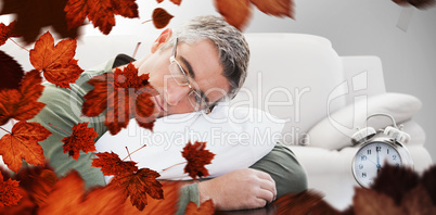 Composite image of man resting on cushion