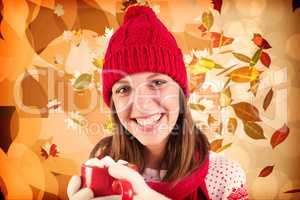 Composite image of young woman enjoying her hot coffee in the wi
