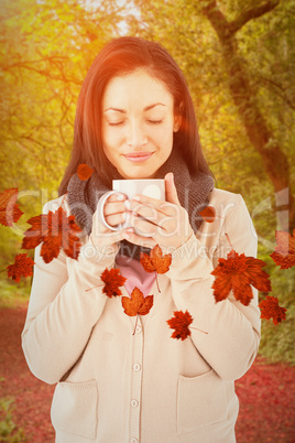 Composite image of smiling woman smelling hot beverage