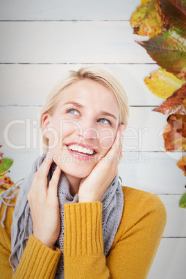 Composite image of smiling woman wearing a scarf