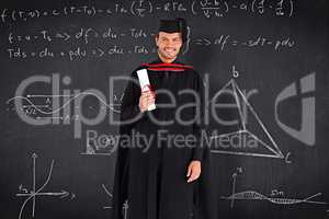 Composite image of charming graduate boy with his diploma