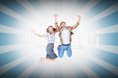 Composite image of geeky hipsters jumping and smiling