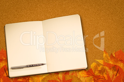 Composite image of notebook and pen