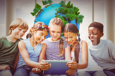 Composite image of children using digital tablet at park