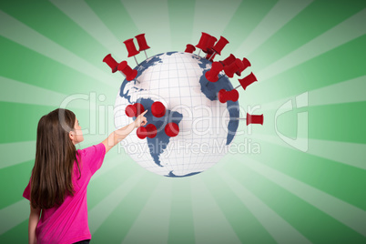 Composite image of cute little girl pointing with finger