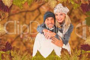 Composite image of portrait of wife embracing husband