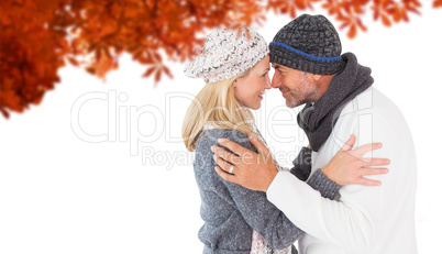 Composite image of smiling cute couple romancing over white back