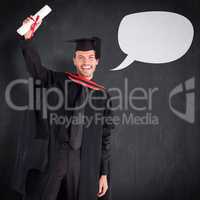 Composite image of smiling handsome boy showing his diploma to t
