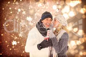 Composite image of happy couple gossiping while drinking hot tea