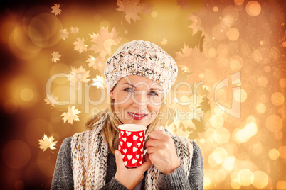 Composite image of portrait of beautiful woman holding mug