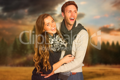 Composite image of happy young couple embracing