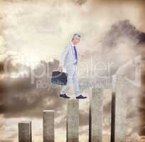 Composite image of side view of businessman walking with briefca