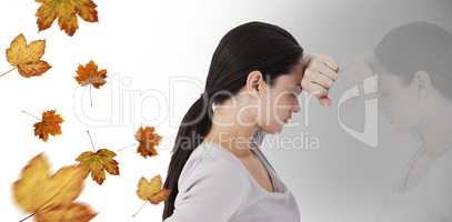 Composite image of sad woman leaning against the wall