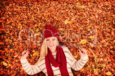 Composite image of festive blonde smiling at camera