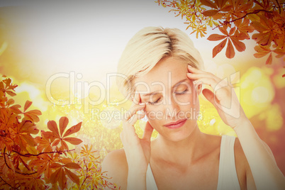 Composite image of pretty blonde with headache touching her temp