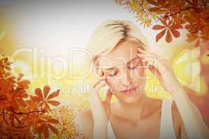 Composite image of pretty blonde with headache touching her temp