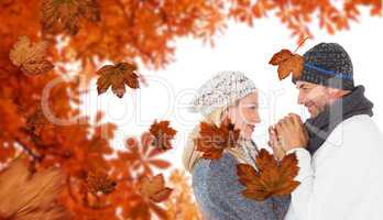 Composite image of cute smiling couple holding hands