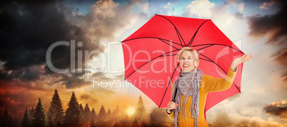 Composite image of woman checking to see if its raining