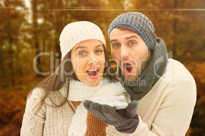 Composite image of young winter couple