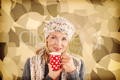 Composite image of portrait of beautiful woman holding mug
