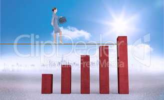 Composite image of businesswoman walking tightrope