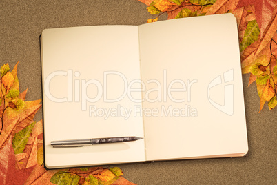 Composite image of notebook and pen