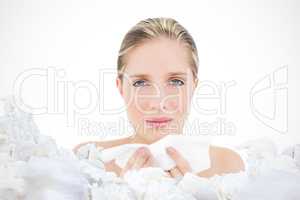 Composite image of unhappy fresh blonde woman sneezing