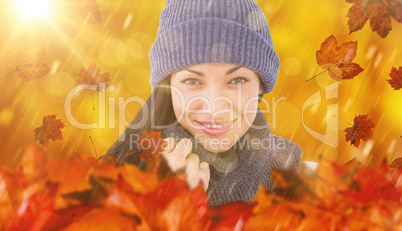 Composite image of attractive brunette looking at camera wearing