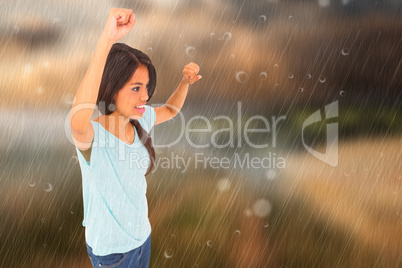 Composite image of brunette cheering