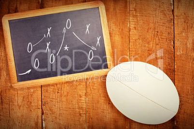 Composite image of close-up of rugby ball