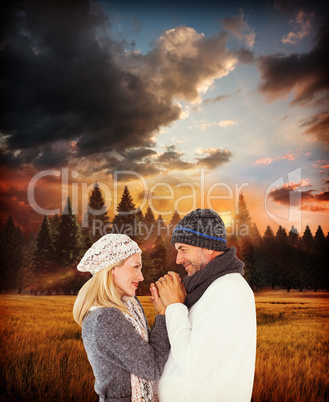 Composite image of cute smiling couple holding hands