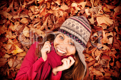 Composite image of cold redhead wearing coat and hat