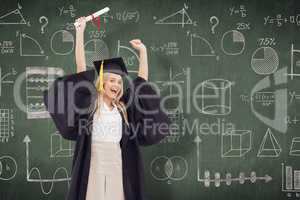 Composite image of blonde student in graduate robe holding up he