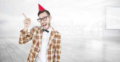 Composite image of geeky hipster in party hat pointing