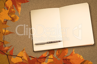 Composite image of notebook and pen