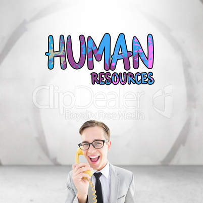 Composite image of geeky businessman talking on retro phone