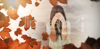 Composite image of troubled woman crying