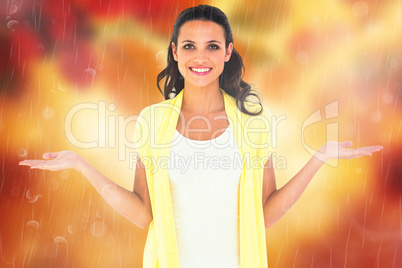 Composite image of pretty brunette presenting with hands