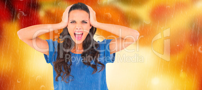 Composite image of angry brunette shouting at camera