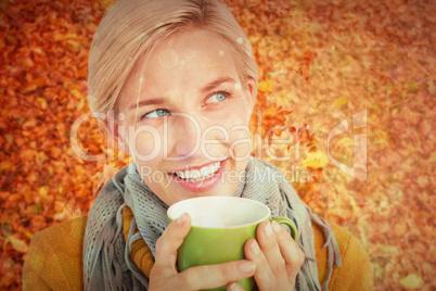 Composite image of close up of woman drinking from a cup