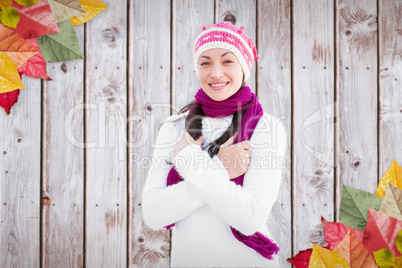 Composite image of attractive woman wearing a warm het