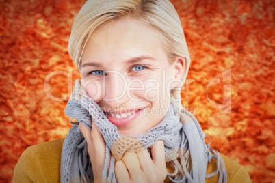 Composite image of smiling woman wearing a scarf