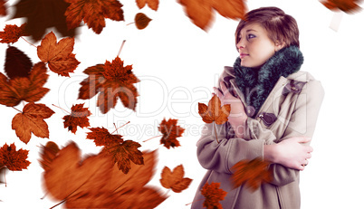 Composite image of thoughtful woman in winter coat