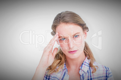 Composite image of pretty hipster with headache