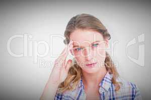 Composite image of pretty hipster with headache
