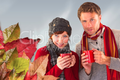 Composite image of couple both having warm drinks